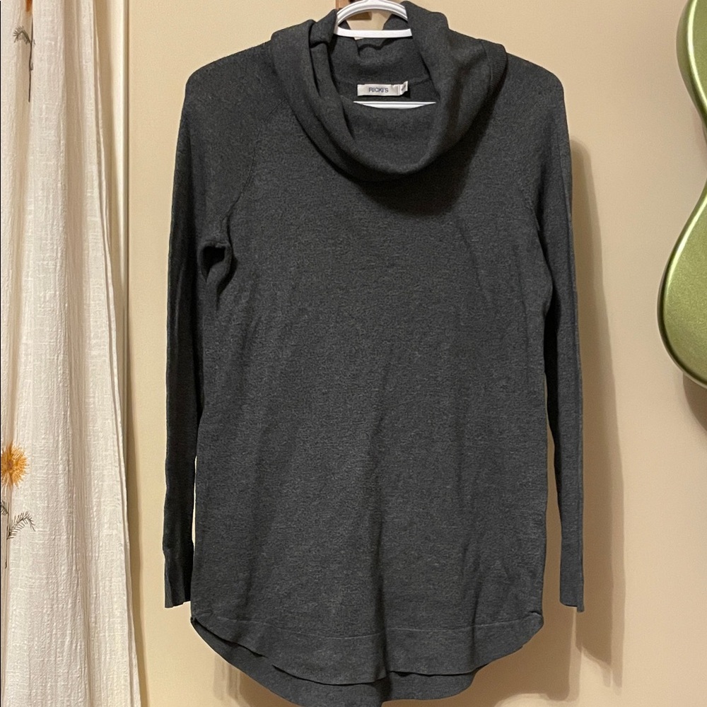 Ricki’s grey turtleneck sweater